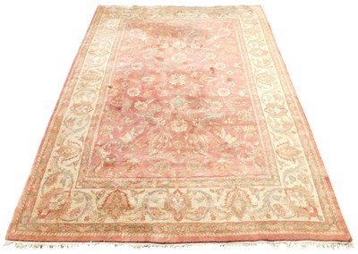Lot 531 - A Caucasian red ground rug, the central field...