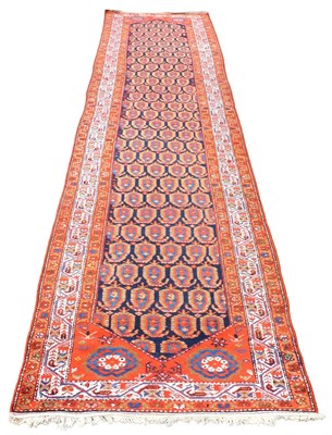 Lot 534 - A Malayer blue ground runner, decorated with...