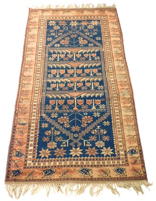 Lot 537 - A Turkish blue ground Tree of Life rug, with...