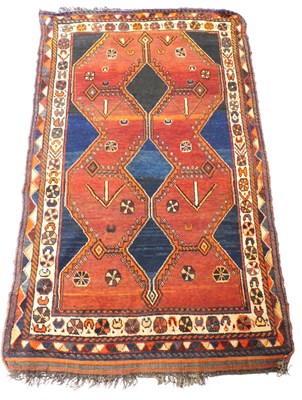 Lot 538 - A Kazak blue and red ground rug, decorated...