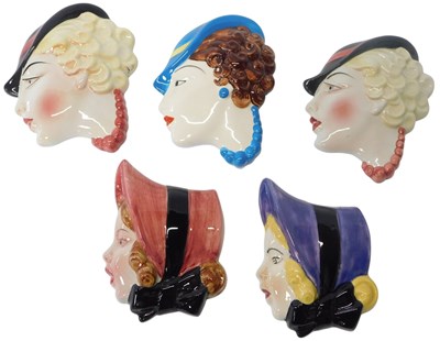 Lot 228 - Five Art Deco style female wall masks, each...
