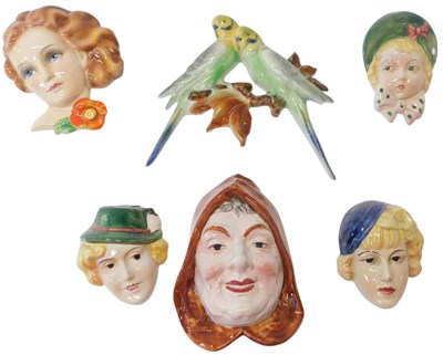 Lot 229 - A group of Art Deco style wall masks, three...