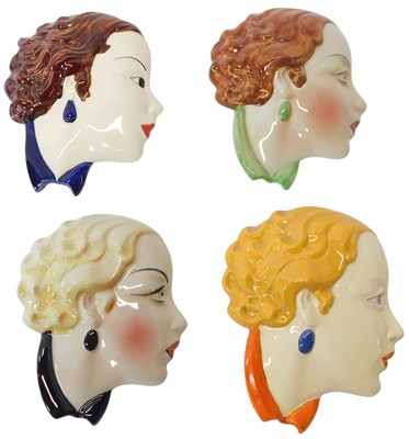 Lot 232 - Four Art Deco style female wall masks, one for...