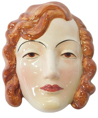 Lot 234 - An Art Deco pottery wall mask, modelled as a...