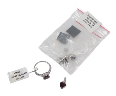 Lot 111 - A jewellery suite, comprising ring, earrings...