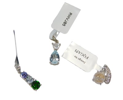 Lot 113 - Three pendants, comprising an aquamarine and...
