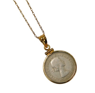Lot 117 - A pendant and chain, the sixpence pendant in...