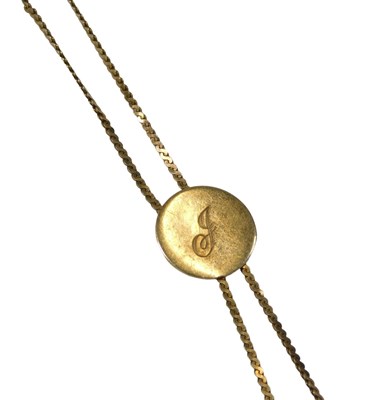 Lot 118 - A 9ct gold pendant and chain, the circular...