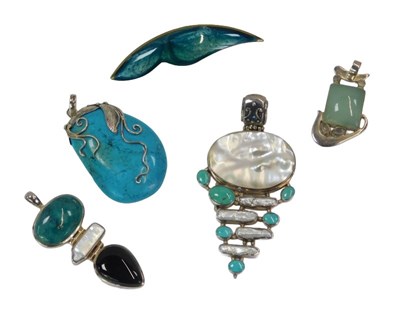 Lot 129 - A group of silver and stone set pendants,...