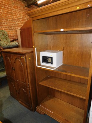 Lot 1042 - A large oak effect bookcase, of five shelves,...
