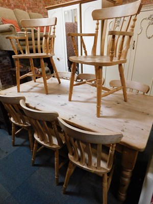 Lot 1044 - A pine kitchen table, along with six single...