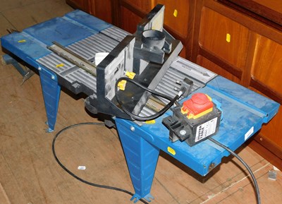 Lot 1071 - A metal router table, with router....
