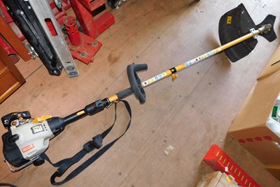 Lot 1073 - A PBC petrol Ryobi strimmer.