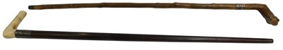 Lot 274 - Two early 20thC walking sticks, each with a...