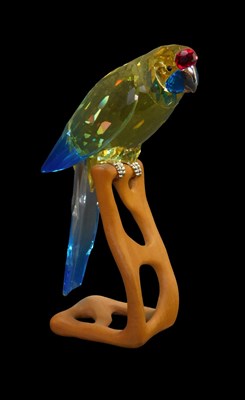 Lot 319 - A Swarovski crystal parrot, in yellow and blue,...