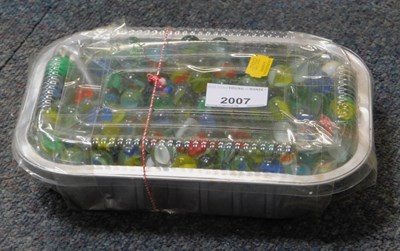 Lot 2007 - A small box containing marbles.