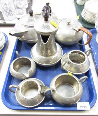 Lot 2035 - A hammered pewter tea and coffee service,...