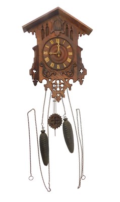 Lot 187 - A 20thC cuckoo clock, the circular dial...
