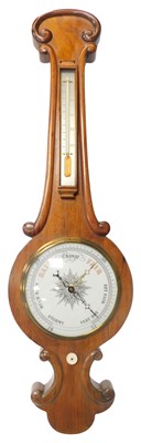 Lot 188 - A Victorian walnut wheel barometer, with a...