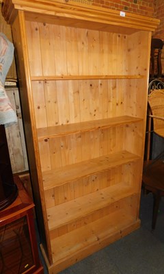 Lot 1005 - A pine open bookcase of five shelves.