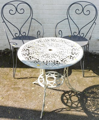 Lot 1117 - A cast metal garden table, and two metal...