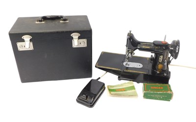 Lot 403 - A Singer model 222K sewing machine, with foot...
