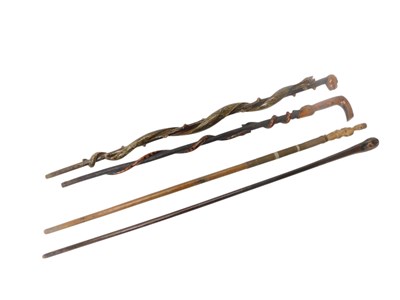 Lot 404 - A group of African and other walking canes,...