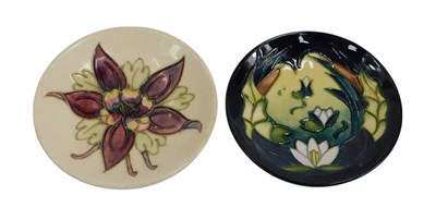 Lot 415 - Two Moorcroft pottery pin dishes, decorated in...