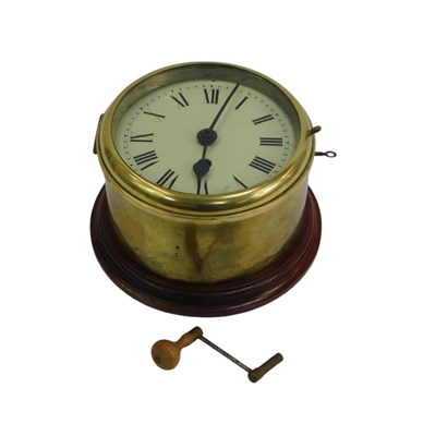 Lot 417 - A brass cased ship's clock, the circular dial...