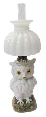 Lot 384 - An Ernst Bohne porcelain oil lamp, with a milk...