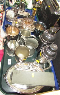 Lot 2055 - Metalware, in the form of two cocktail shakers,...