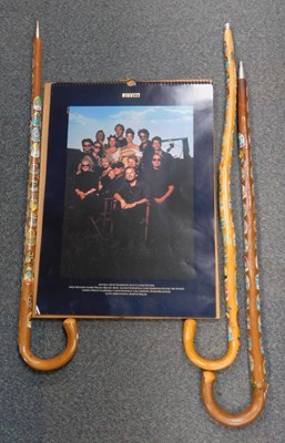 Lot 2101 - Three walking sticks, and a Pirelli calendar.