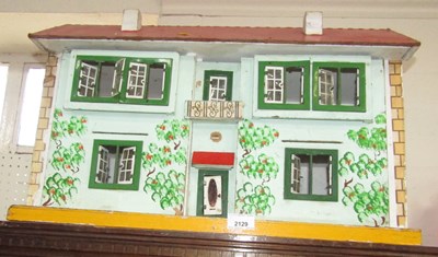 Lot 2129 - A painted doll's house.
