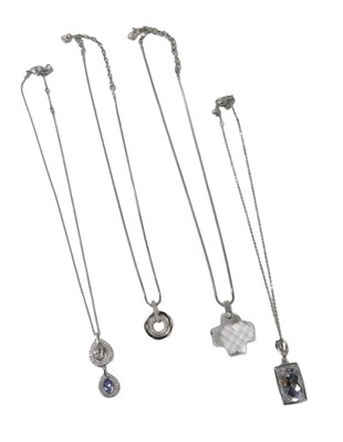 Lot 310 - Four Swarovski crystal pendants, comprising...