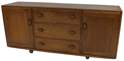 Lot 626 - An Ercol elm Windsor sideboard, with three...