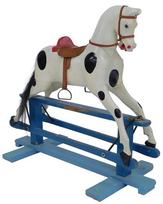 Lot 555 - A Victorian painted pine rocking horse, the...