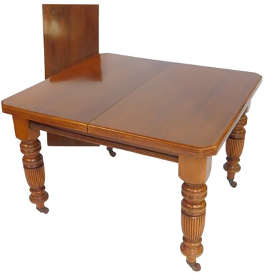 Lot 574 - A Victorian walnut dining table, the canted...