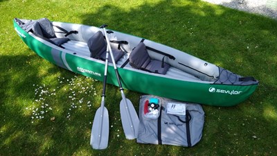 Lot 567 - A Sevylor inflatable canoe, with two paddles...