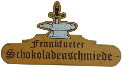 Lot 566 - A 20thC German wooden shop sign, carved with a...