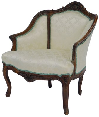 Lot 584 - A French walnut armchair, with a flower head,...