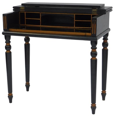 Lot 590 - An early 20thC black painted and parcel gilt...