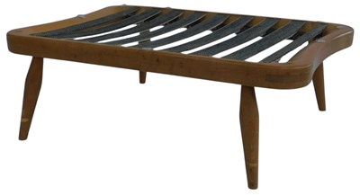 Lot 589 - An Ercol style light elm footstool, with...