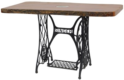 Lot 602 - A 20thC table, with a rustic wooden top,...