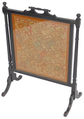 Lot 608 - A Victorian ebonised fire screen, inset with...
