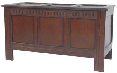 Lot 609 - An early 18thC oak coffer, the three-panelled...