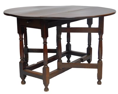 Lot 617 - A 19thC oak gateleg table, 75cm high, 111cm...