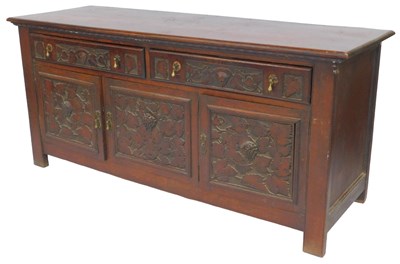 Lot 622 - An oak sideboard, with two leaf and vine...