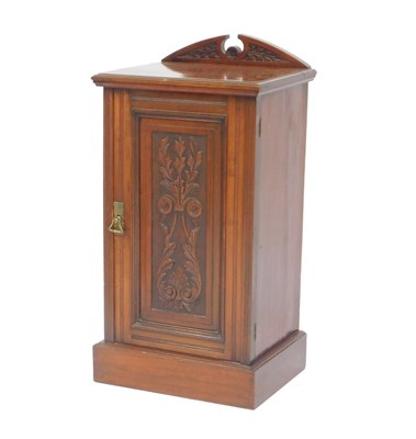 Lot 630 - A Victorian walnut pot cupboard, the raised...