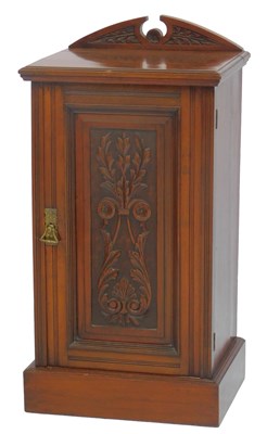 Lot 631 - A Victorian walnut pot cupboard, with a carved...