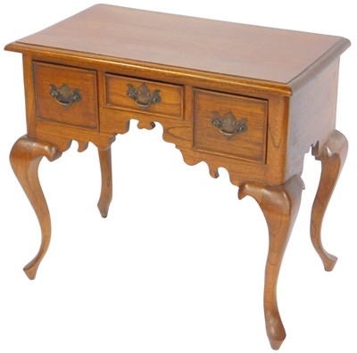 Lot 634 - A 20thC oak lowboy, the top with a moulded...